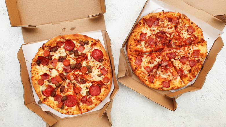 Pizza boxes left on counter