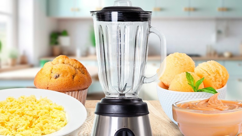 Blender with muffins, ice cream, scrambled eggs, and sauce