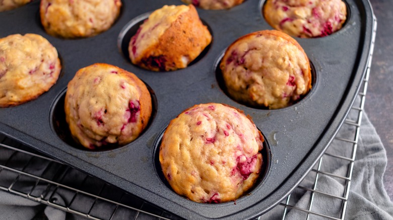 Cooked raspberry muffins in a tin