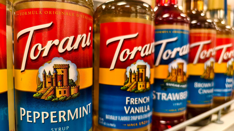 close-up of assorted seasonal Torani syurps on shelf