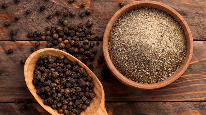 Black peppercorns and ground black pepper