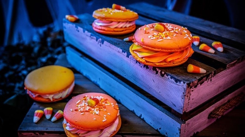 Orange Candy Corn Macarons on crate