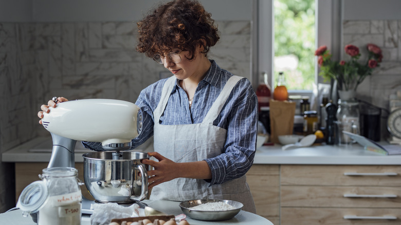 woman looking down at mixer