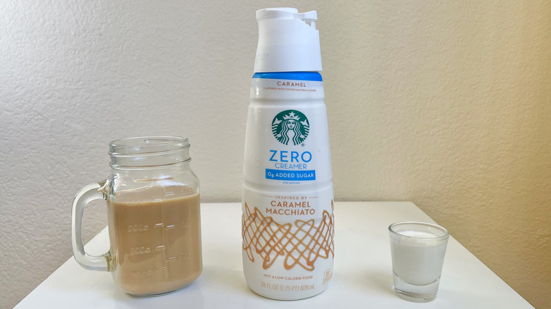 Starbucks Caramel Macchiato Zero Sugar Creamer in bottle, shot glass, and in jar of coffee