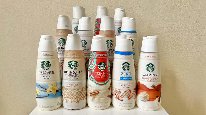 Bottles of Starbucks creamers stacked on table