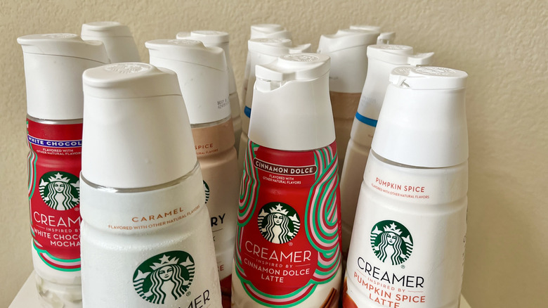 Starbucks creamer bottles on table