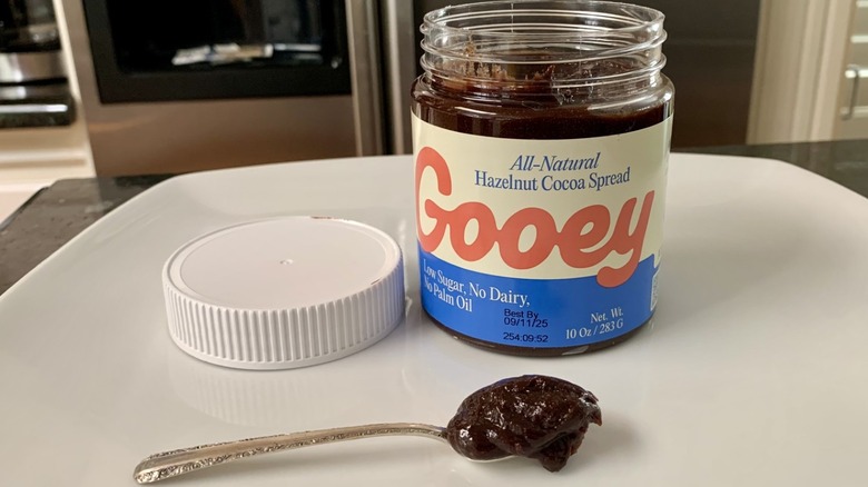 Spoonful and jar of Gooey All-Natural Hazelnut Cocoa Spread