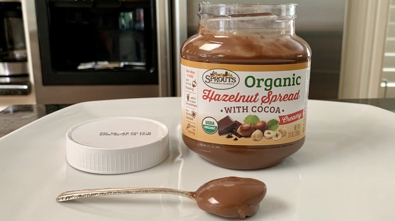 Sprouts Organic Hazelnut Spread with Cocoa next to spoonful