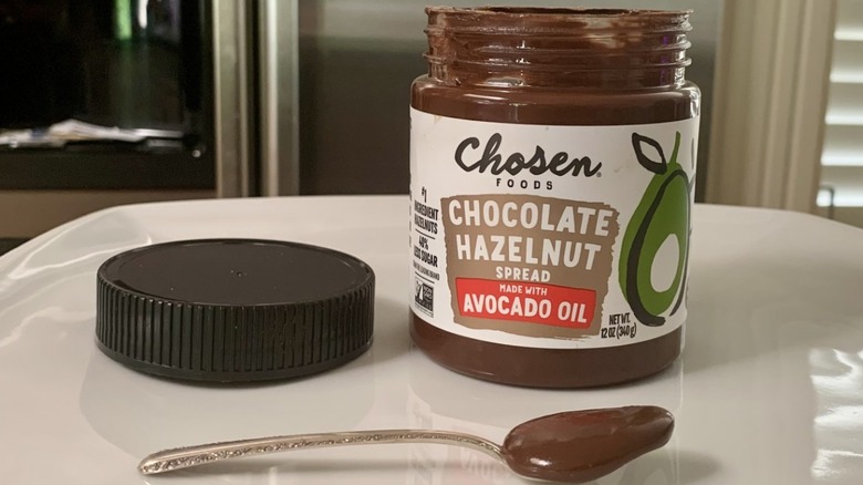 Chosen Foods Chocolate Hazelnut Spread with spoonful of it in front of jar