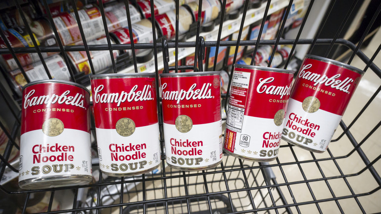 Cans of Campbell's Chicken Noodle in a shopping basket