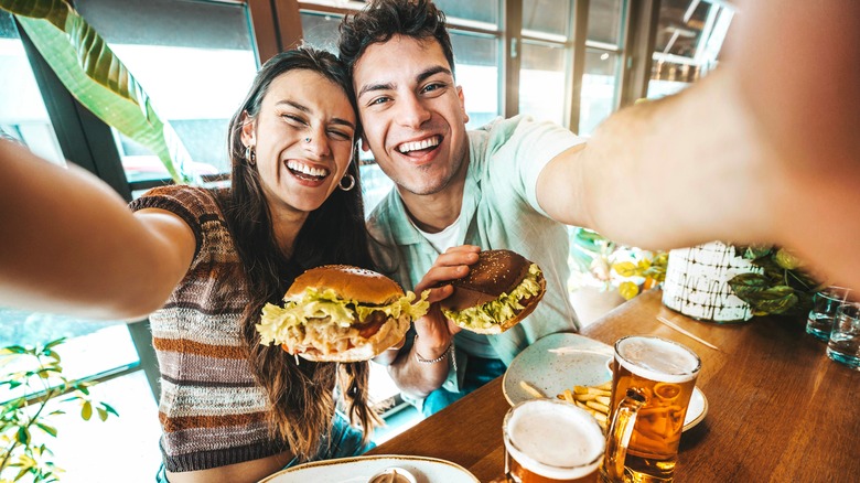 Couple with burgers and beer