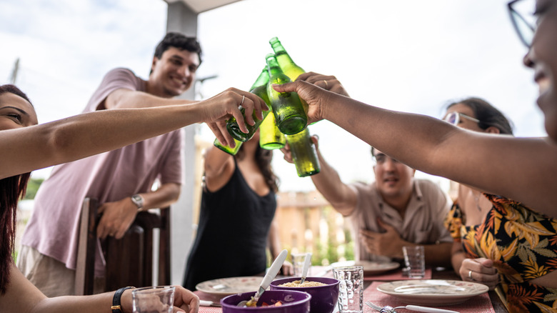 Guests toasting at a barbecue