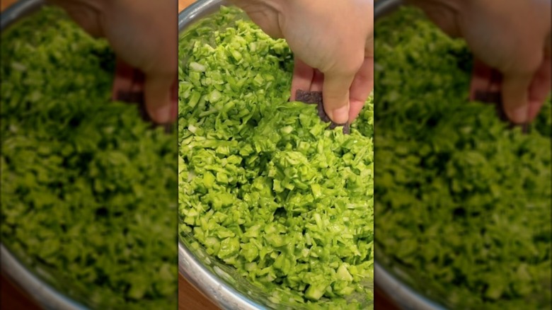 Dipping a cracker into a bowl of Green Goddess salad