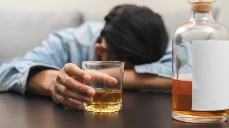 Man drunk after drinking whiskey