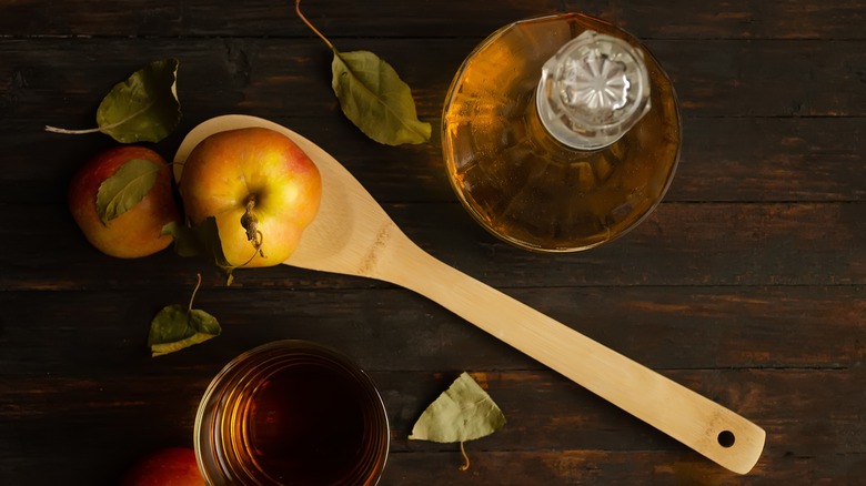 wooden spoon with apples