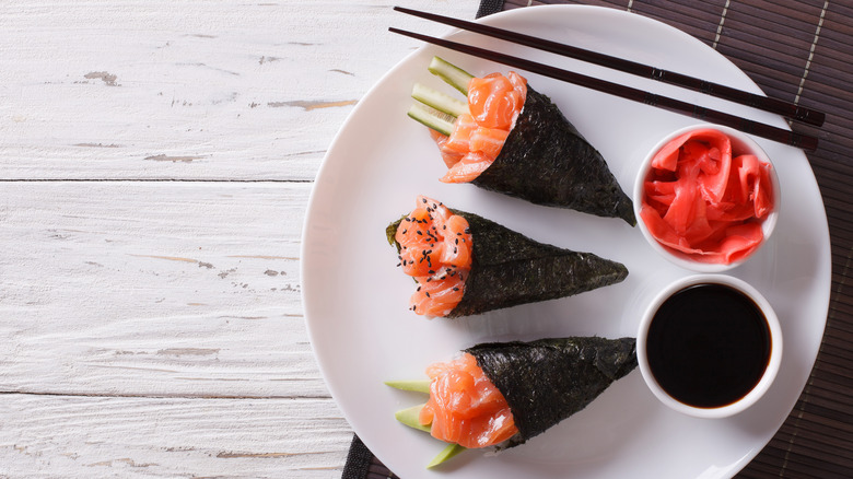 three sushi hand rolls