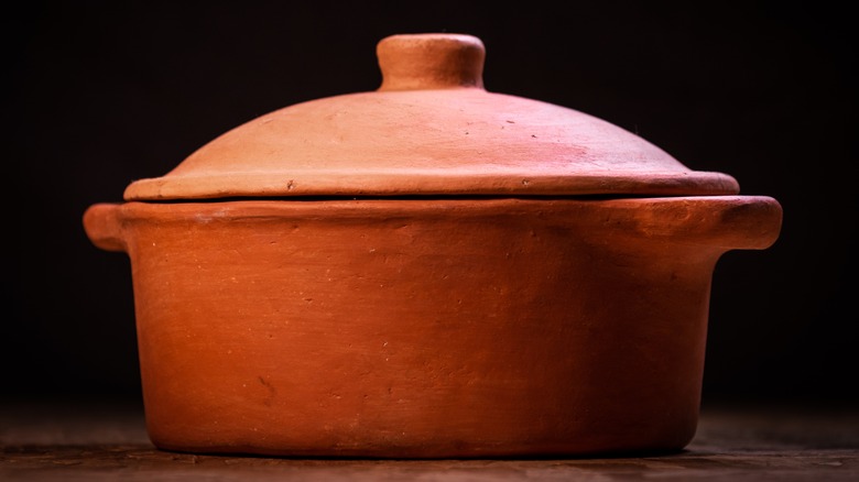 Clay pot on wood table