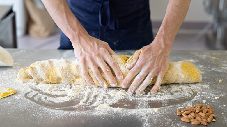 hands shaping biscotti dough