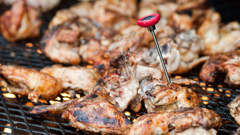 thermometer in chicken on grill