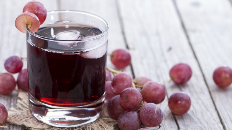 Glass of juice with grapes