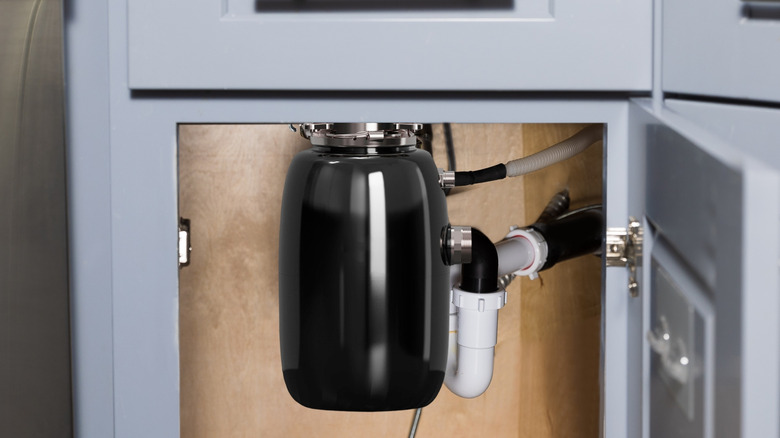 A garbage disposal under a sink