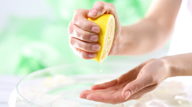 Lemon juice being squeezed