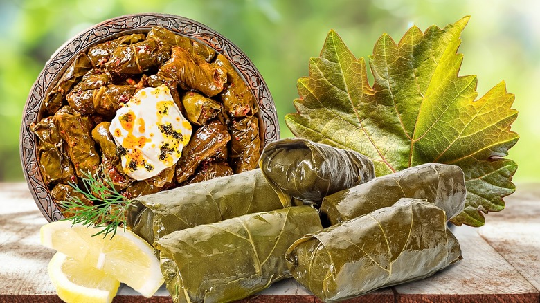 plate dolmas grape leaves lemon 