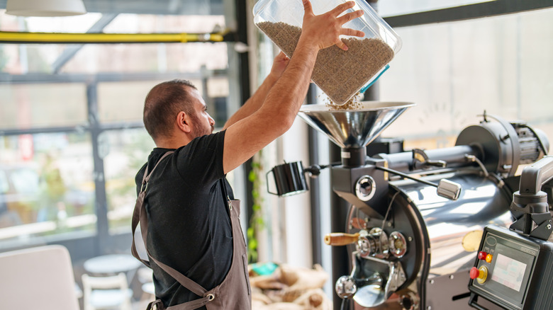 man roasting coffee beans