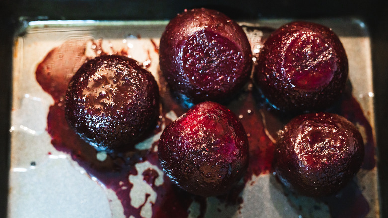 Roasted whole beets on pan