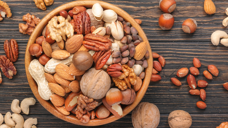 Assorted nuts in wooden bowl