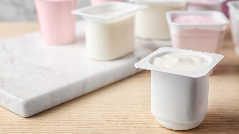 Pink and white yogurt cups