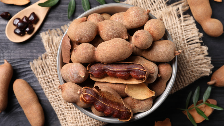 Whole tamarind pods in bowl