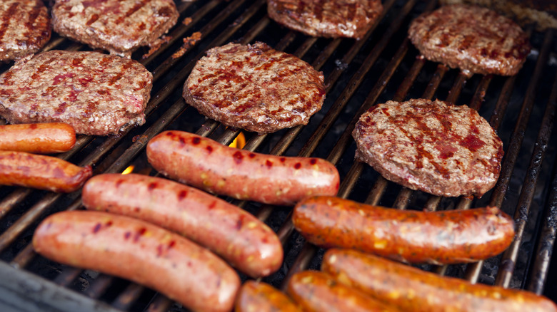 hot dogs on a grill