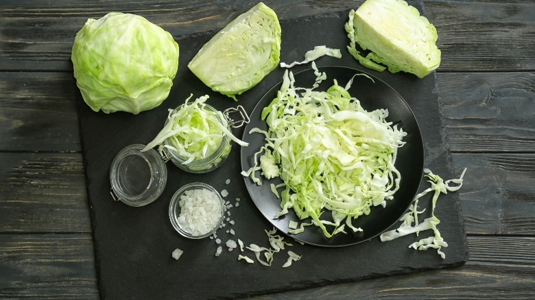 whole, halved, and shredded cabbage