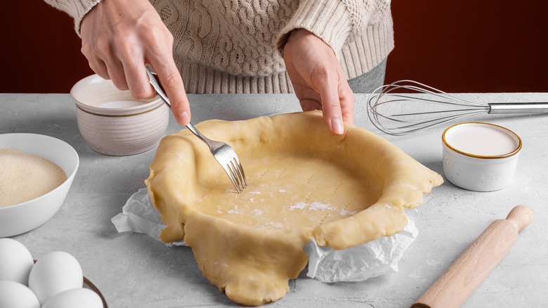 Person making pie crust