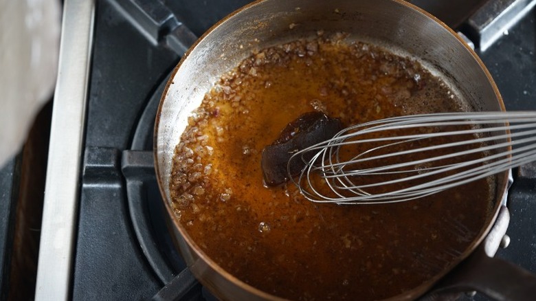 whisk deglazing a pan