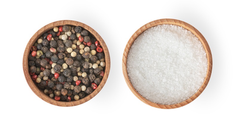 salt and peppercorns in bowls