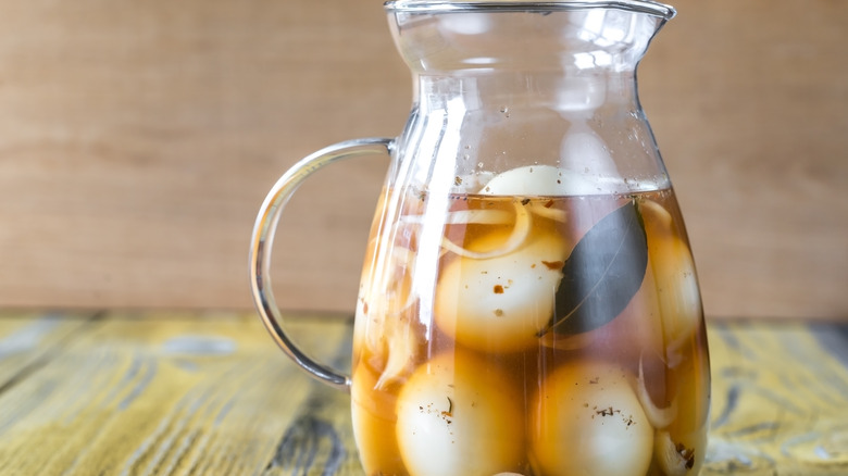 Pickled eggs in glass jug