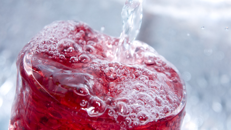 Soda pouring into a glass