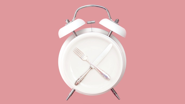 Alarm clock with cutlery hands