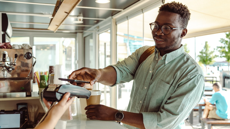 person buying coffee