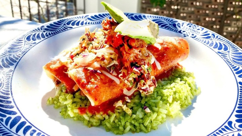 Duck enchiladas over cilantro rice