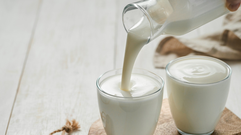 Buttermilk pouring in glass