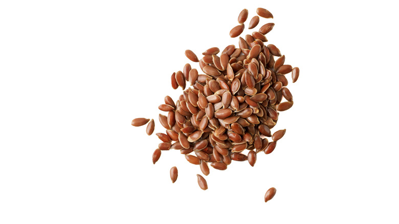 Flax seeds on white background 