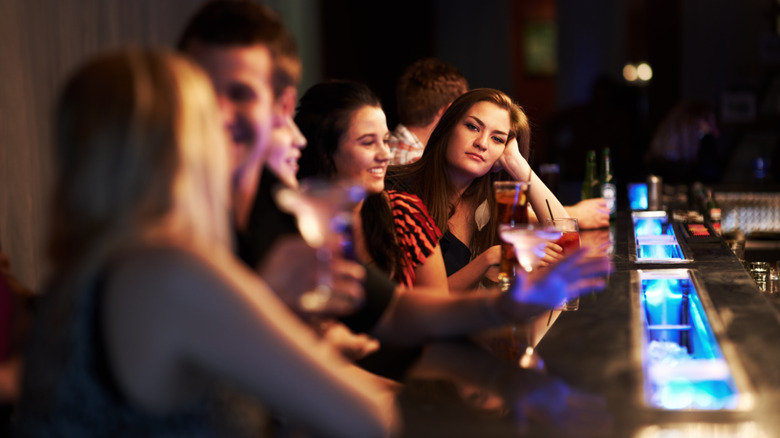 group waiting at the bar