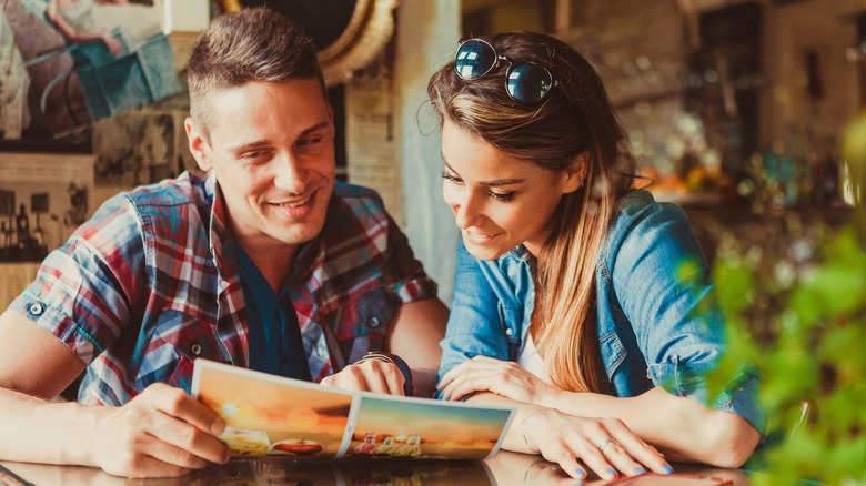 couple looking at menu