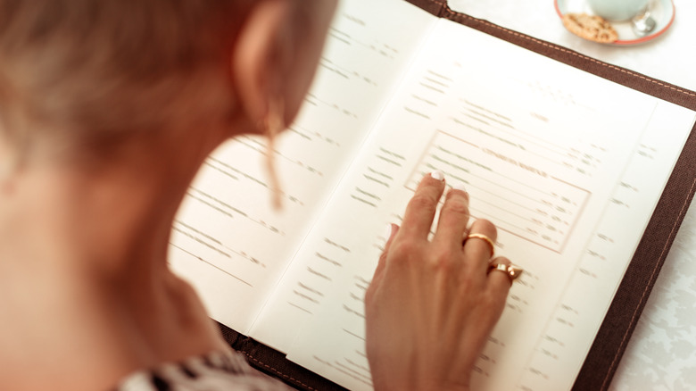 woman reading menu