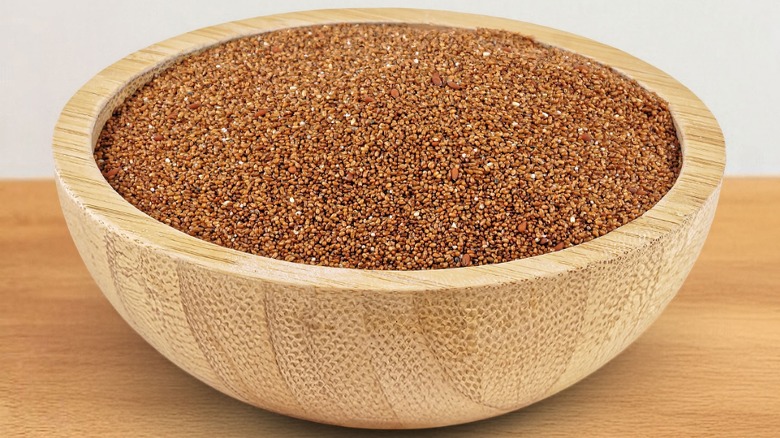 Wooden bowl filled with teff seeds