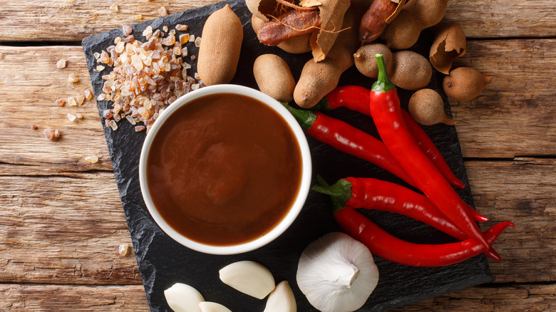 Tamarind chutney with pods and ingredients