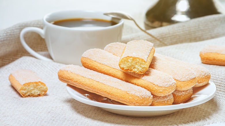 boudoirs cookies on plate with a coffee cup